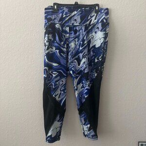 Blue marble-print leggings with black mesh detail